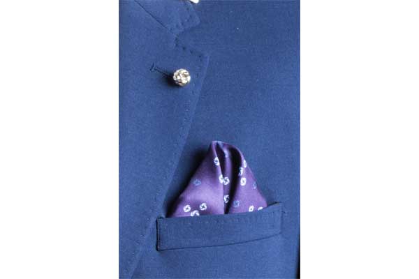 Sky Blue Revolving Knot Silk Pocket Square by Elizabeth Parker in jacket pocket